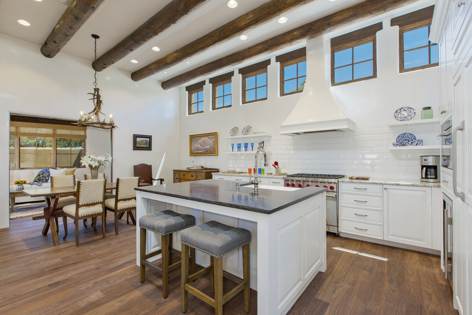 Traditional Santa Fe custom kitchen with white cabinetry and vigas