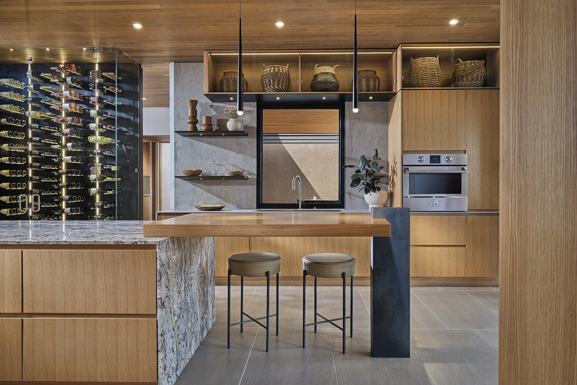 Warm contemporary custom kitchen by Zachary and Sons Homes in Santa Fe, New Mexico